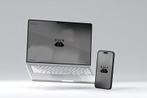 Silver laptop next to smartphone both showing pixelated cloud icon on screen
